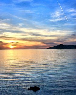 Scenic view of sea at sunset