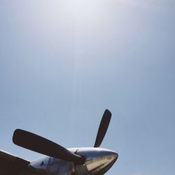 Low angle view of propeller plane against clear sky