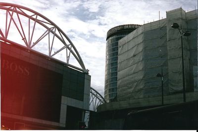 Low angle view of factory against sky