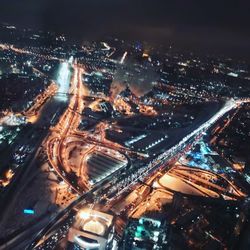 High angle view of illuminated buildings in city at night