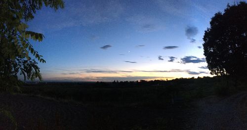 Silhouette landscape against sky during sunset