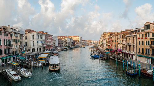 Boats in grand canal against sky