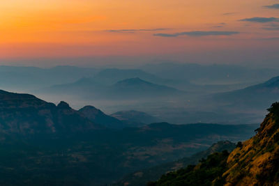 Scenic view of mountains against sky during sunset