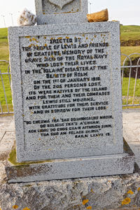 Text on stone at cemetery