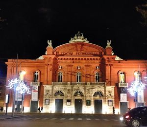 Low angle view of illuminated building at night