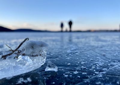 Close-up of frozen sea against sky