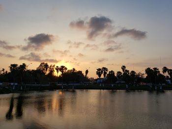 Scenic view of lake against sky during sunset