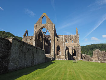 Old ruin building against blue sky