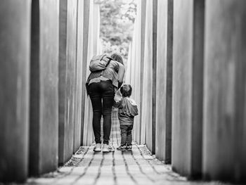 Rear view of man and woman looking away