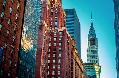Low angle view of buildings against blue sky
