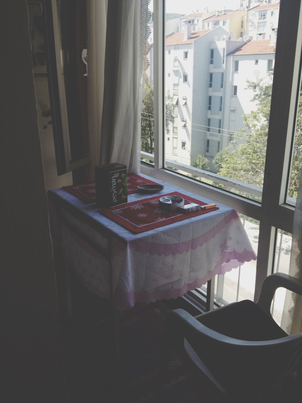 indoors, window, table, architecture, chair, home interior, glass - material, built structure, house, transparent, curtain, absence, restaurant, day, building exterior, empty, balcony, domestic room, no people, sunlight