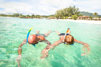 People swimming in sea