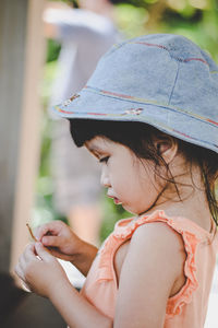 Close-up of girl holding hands