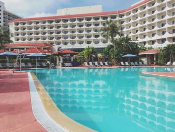 View of swimming pool against buildings