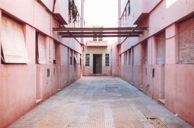 Empty alley amidst buildings