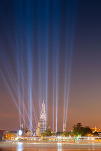 View of illuminated city against sky at night