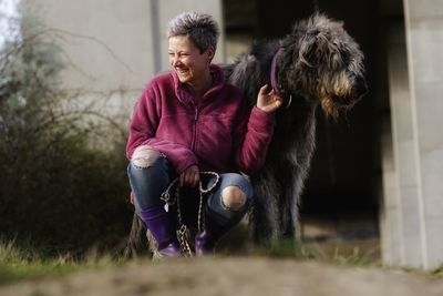 Woman with dog outdoors