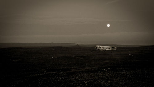 Scenic view of field against sky at night