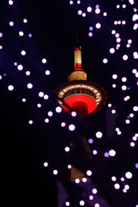 Low angle view of illuminated lights at night