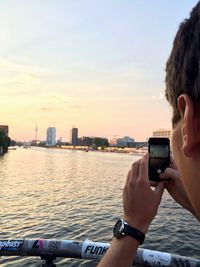 Woman photographing through smart phone