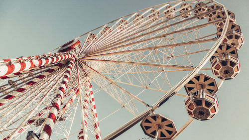 Low angle view of ferris wheel against sky