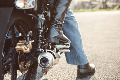 Low section of couple on motorbike