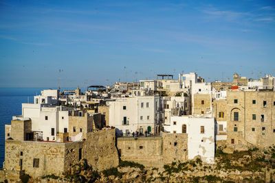 Residential buildings against blue sky