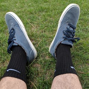 Low section of person wearing shoes