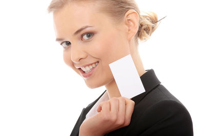 Portrait of a smiling young woman over white background