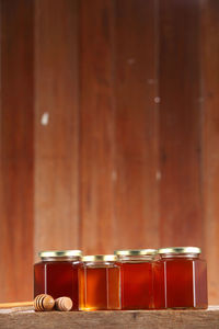 Close-up of honey in jars on table