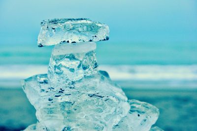 Close-up of ice crystals against sea