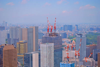 Modern buildings in city against sky
