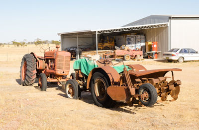 Tractor on field against sky