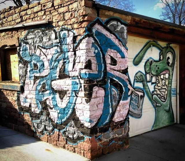 graffiti, art, art and craft, creativity, architecture, built structure, building exterior, text, wall - building feature, human representation, street art, western script, vandalism, wall, day, outdoors, no people, communication, multi colored