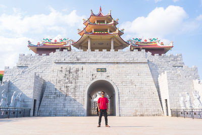 Man standing against temple