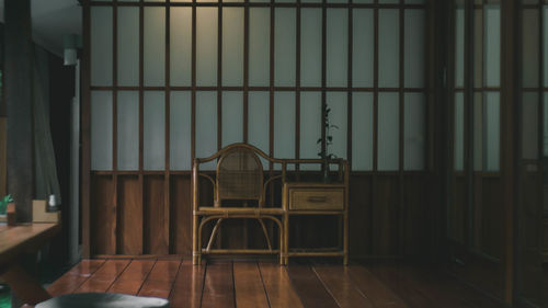 Empty chairs and tables in building