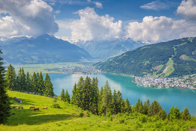 Scenic view of lake and mountains against sky