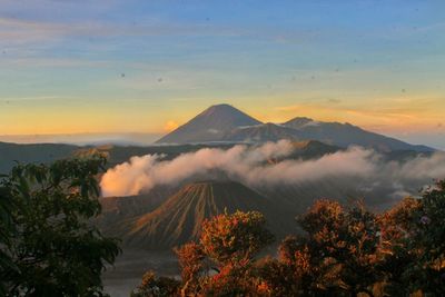 Scenic view of mountains against sky during sunset