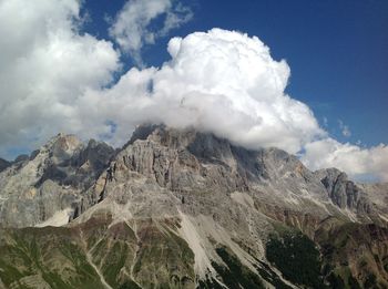 Low angle view of majestic mountains against sky