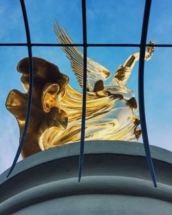 Low angle view of building against blue sky