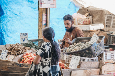 Friends at market stall