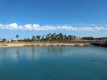 Scenic view of sea against blue sky