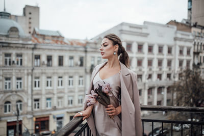 Young woman looking at city