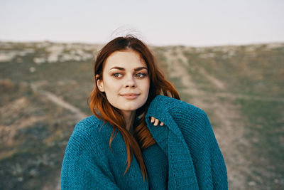 Portrait of beautiful young woman in winter