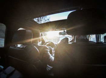 Man seen through car windshield