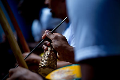 Cropped hands playing music instrument