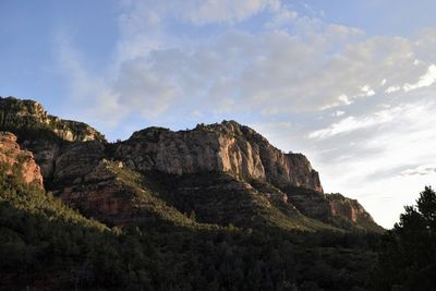 Low angle view of rocks against sky