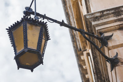 Low angle view of old building with lantern