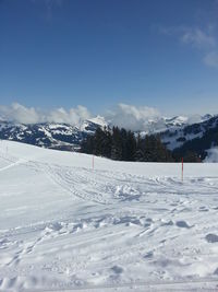 Snow covered landscape against sky