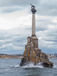 Statue of liberty against cloudy sky